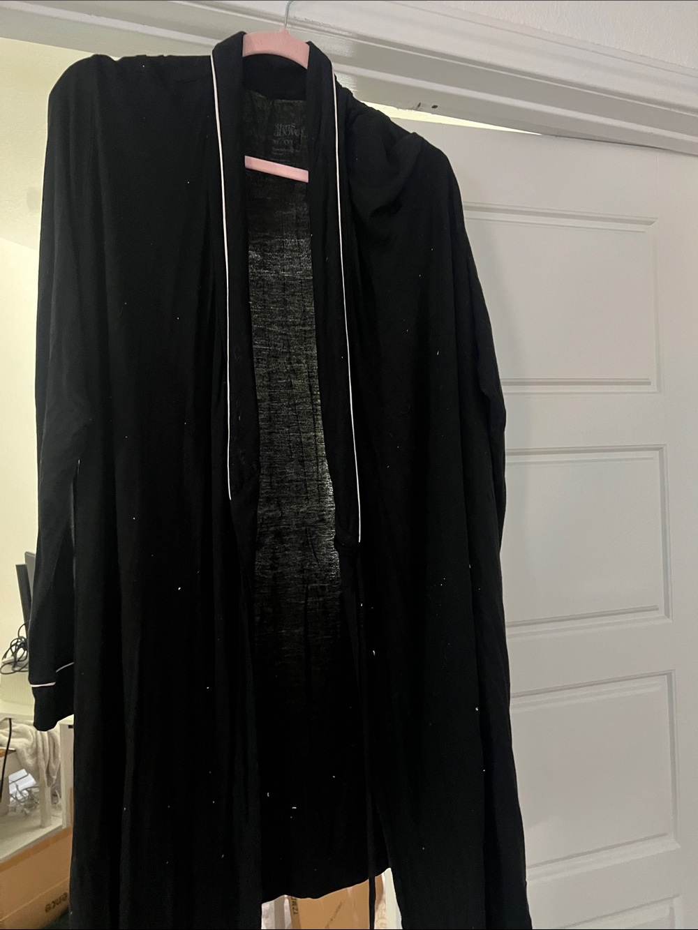 stars above Black Open-Front robe with White Piping